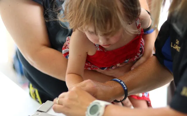 girl getting fingerprinted
